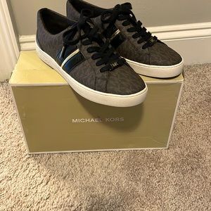 Brand new Michael Kors tennis shoes size 6 1/2 color brown and black.